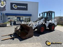 Ahlmann AL80 met 4500 uur. bj 2004